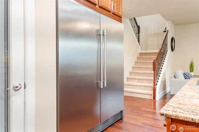 a view of front door with wooden floor