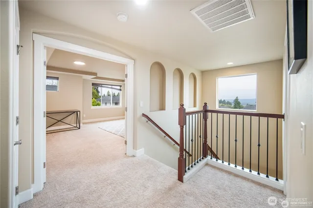 a view of a hallway with staircase