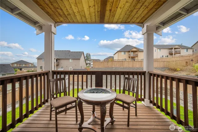 a view of a balcony with chairs