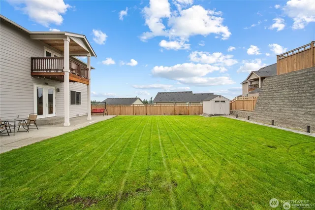 a view of a backyard with a garden and plants