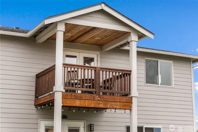 a view of a house with wooden fence