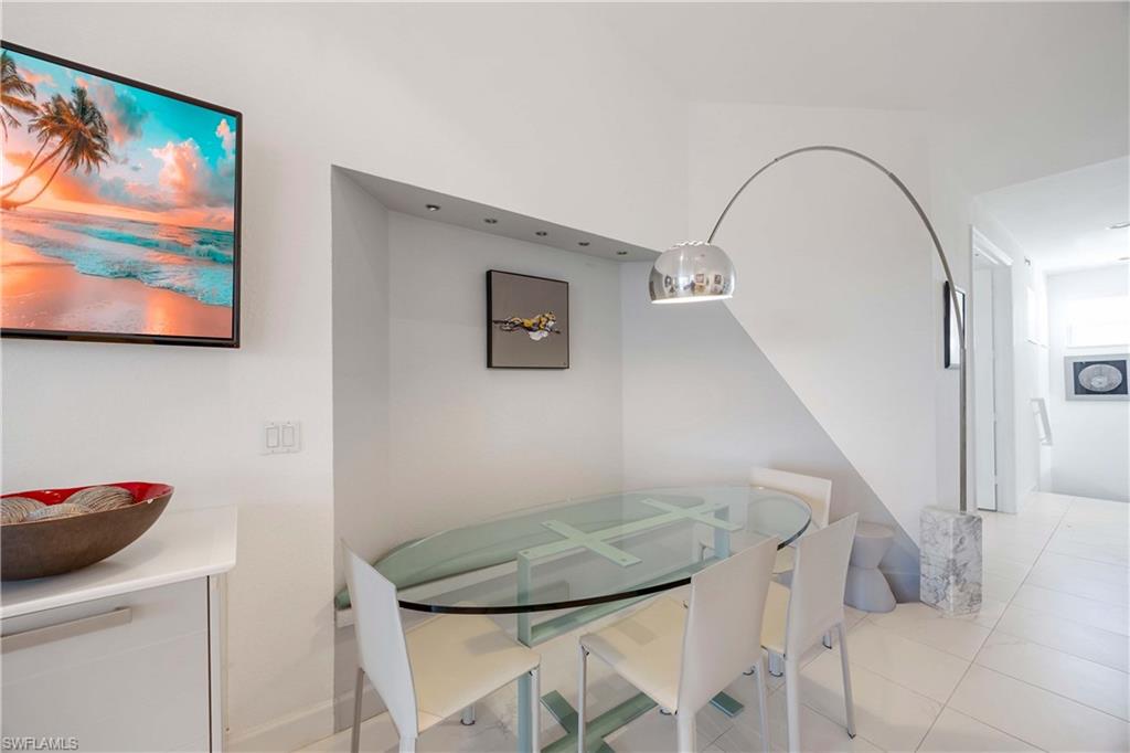 4685 Hawks Nest Way, Unit J201 Naples, FL 34114 - Photo 17 of 24 a view of entryway with kitchen and hallway