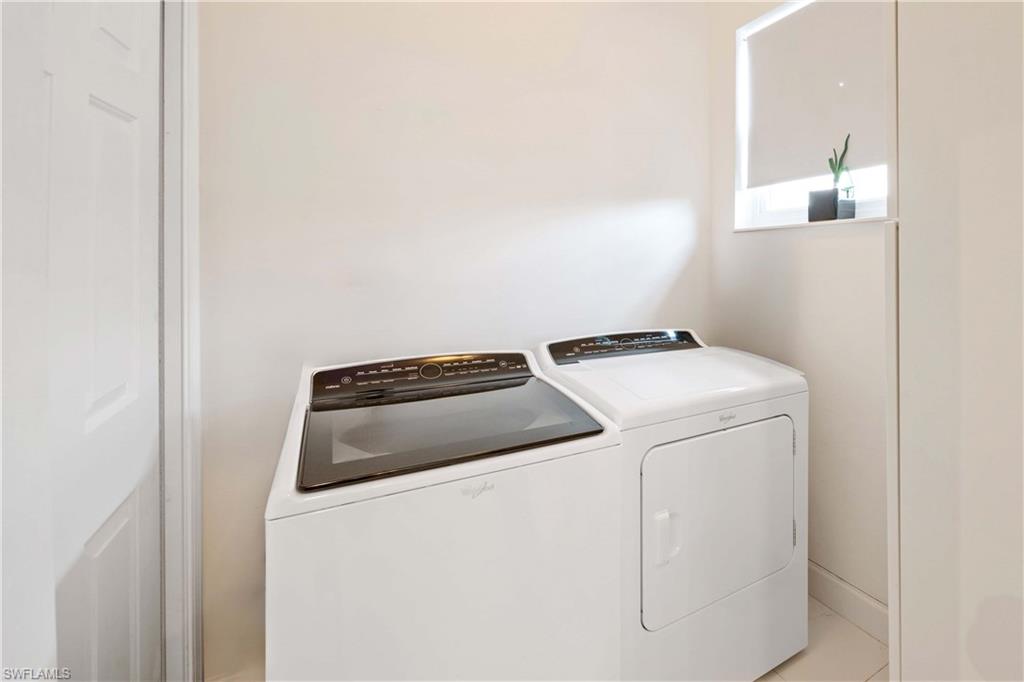 4685 Hawks Nest Way, Unit J201 Naples, FL 34114 - Photo 21 of 24 a utility room with dryer and washer
