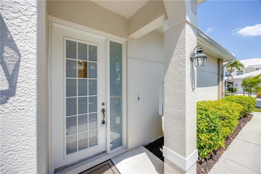 4685 Hawks Nest Way, Unit J201 Naples, FL 34114 - Photo 3 of 24 a view of balcony with potted plants