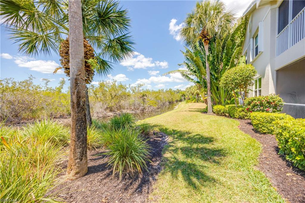 4685 Hawks Nest Way, Unit J201 Naples, FL 34114 - Photo 4 of 24 a view of ocean view with large tree