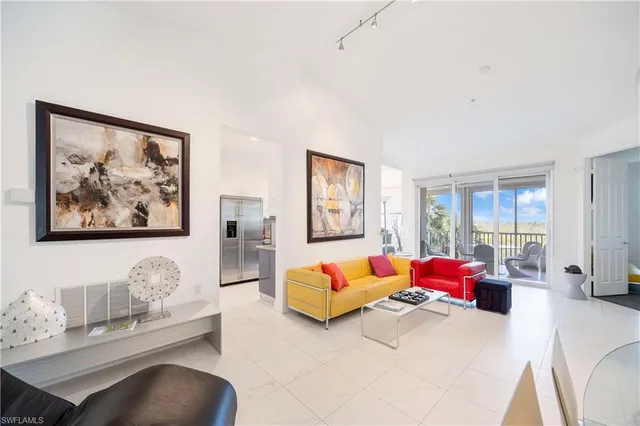 a bedroom with furniture and wooden floor