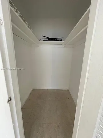 a view of a room with racks on the wall