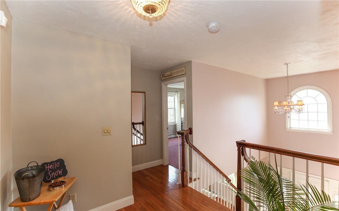 200 Ferncroft Road Somerset, MA 02726 - Photo 20 of 38 Hall upstairs with view into the 2 beds on this side of home with Master Suite on other side.
