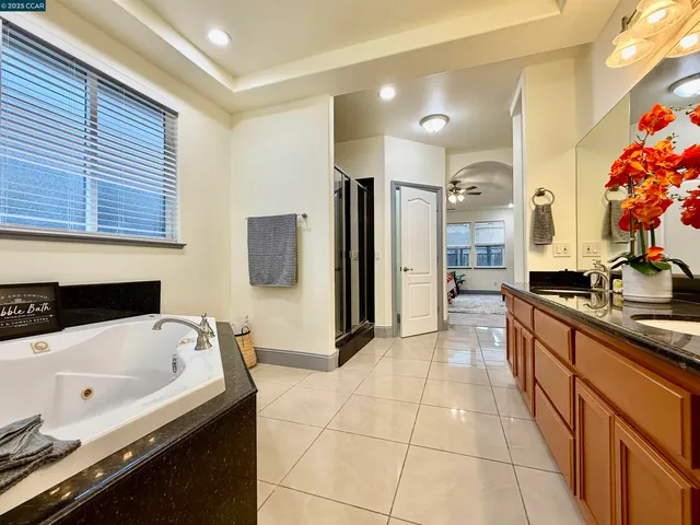 a large white kitchen with a large window