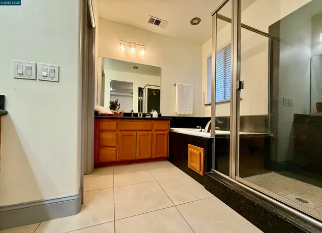 a kitchen with stainless steel appliances a sink stove and refrigerator