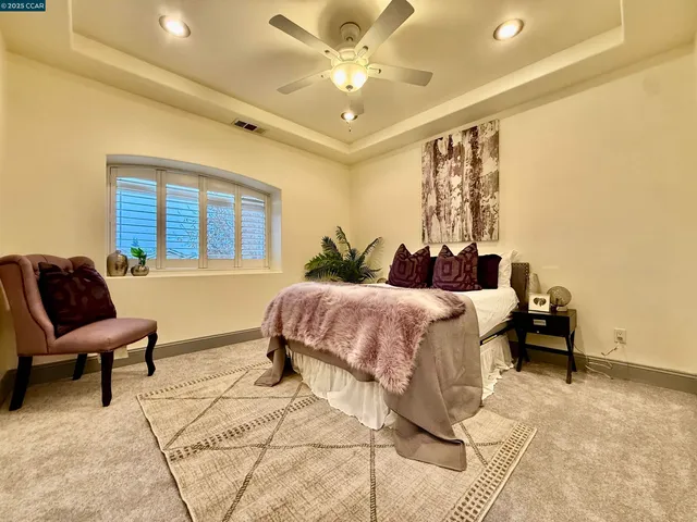 a bedroom with a bed and a couch