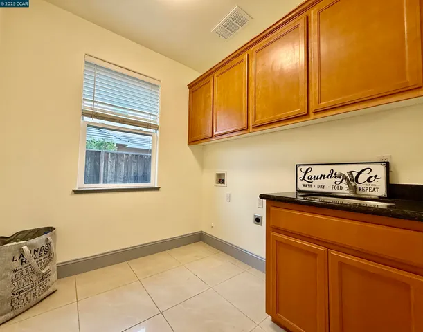 a view of a storage and utility room with washer and dryer