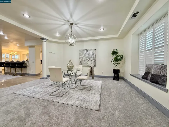 a view of a livingroom with furniture and a ceiling fan