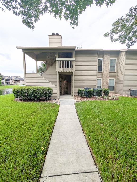 10200 Belle Rive Boulevard, Unit 241 Jacksonville, FL 32256 - Photo 1 of 1 a front view of a house with a yard and garage