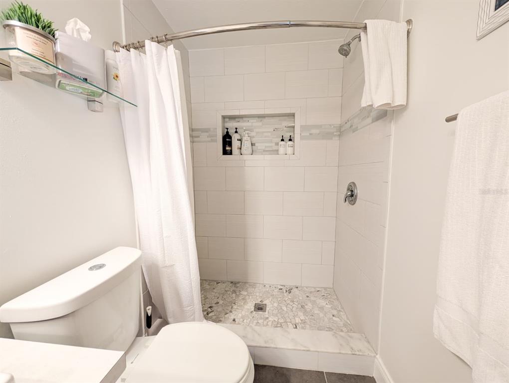 10200 Belle Rive Boulevard, Unit 241 Jacksonville, FL 32256 - Photo 14 of 25 a bathroom with a sink toilet and shower