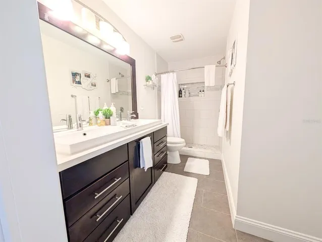 a view of a lake with a table and chairs