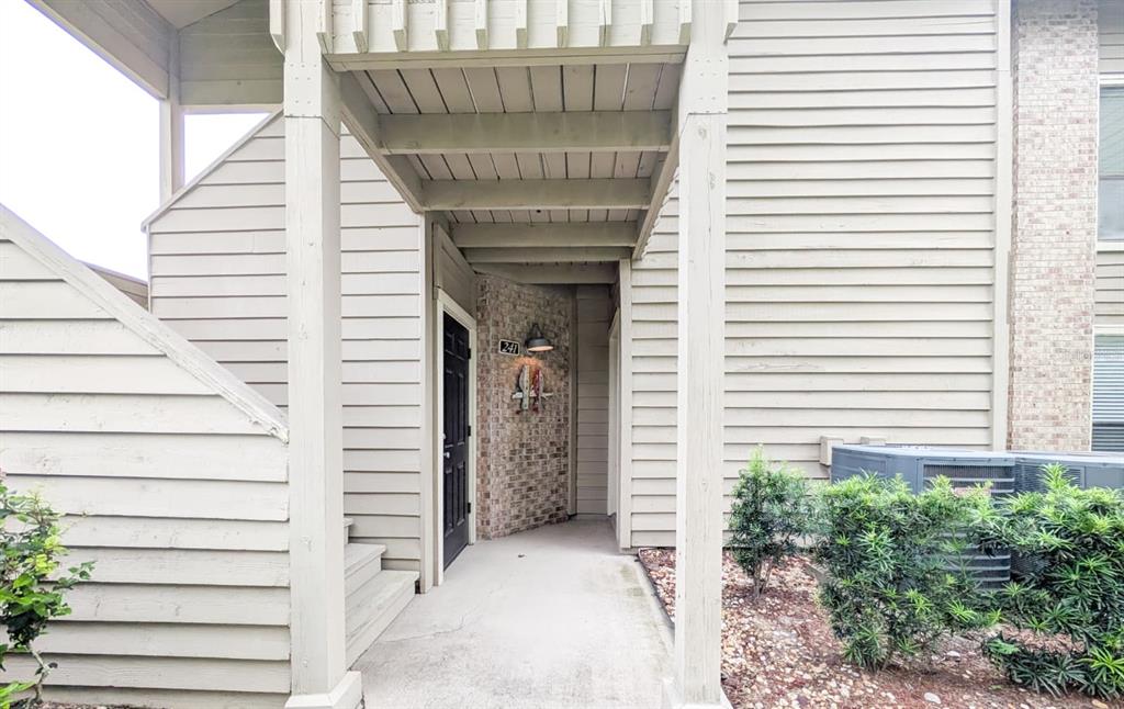 10200 Belle Rive Boulevard, Unit 241 Jacksonville, FL 32256 - Photo 19 of 25 a front view of a house with a white door