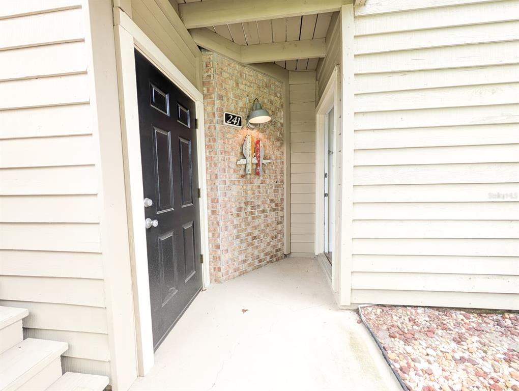 10200 Belle Rive Boulevard, Unit 241 Jacksonville, FL 32256 - Photo 20 of 25 a view of front door and bedroom