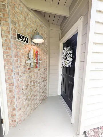 a view of a hallway to a window