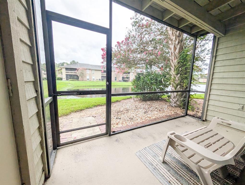10200 Belle Rive Boulevard, Unit 241 Jacksonville, FL 32256 - Photo 24 of 25 a view of a floor to ceiling window with wooden floor