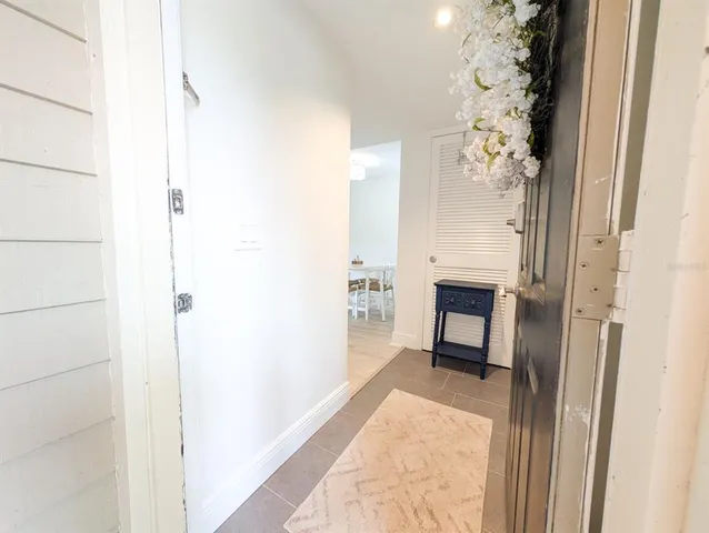 a view of hallway with closet