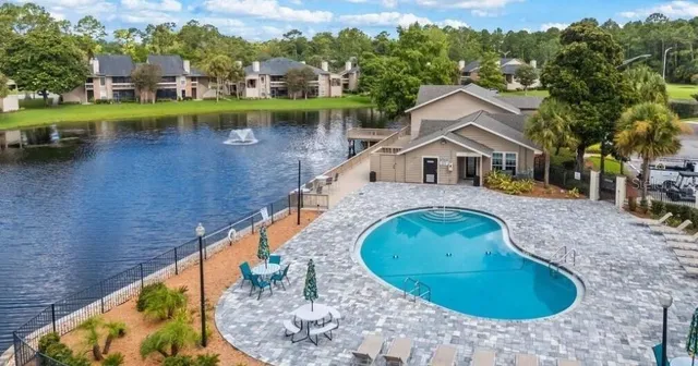 swimming pool view with a outdoor seating