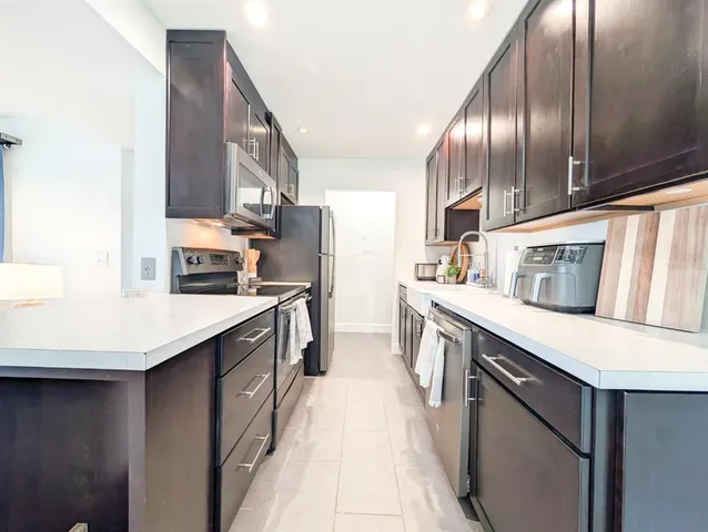 a view of a garden with a building in the background