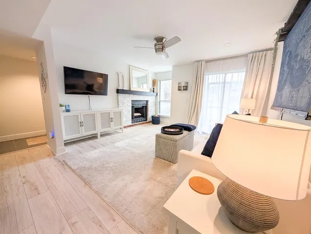 a kitchen with stainless steel appliances a refrigerator a sink a stove and cabinets