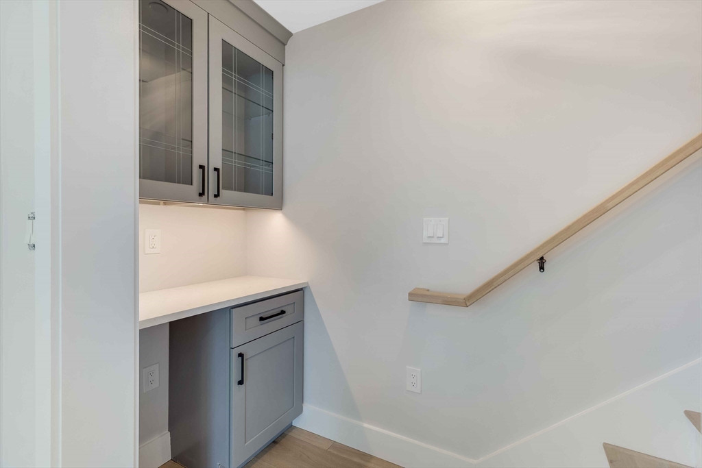 8 Crystal Street, Unit 3 Melrose, MA 02176 - Photo 11 of 24 a bathroom with a sink and a mirror