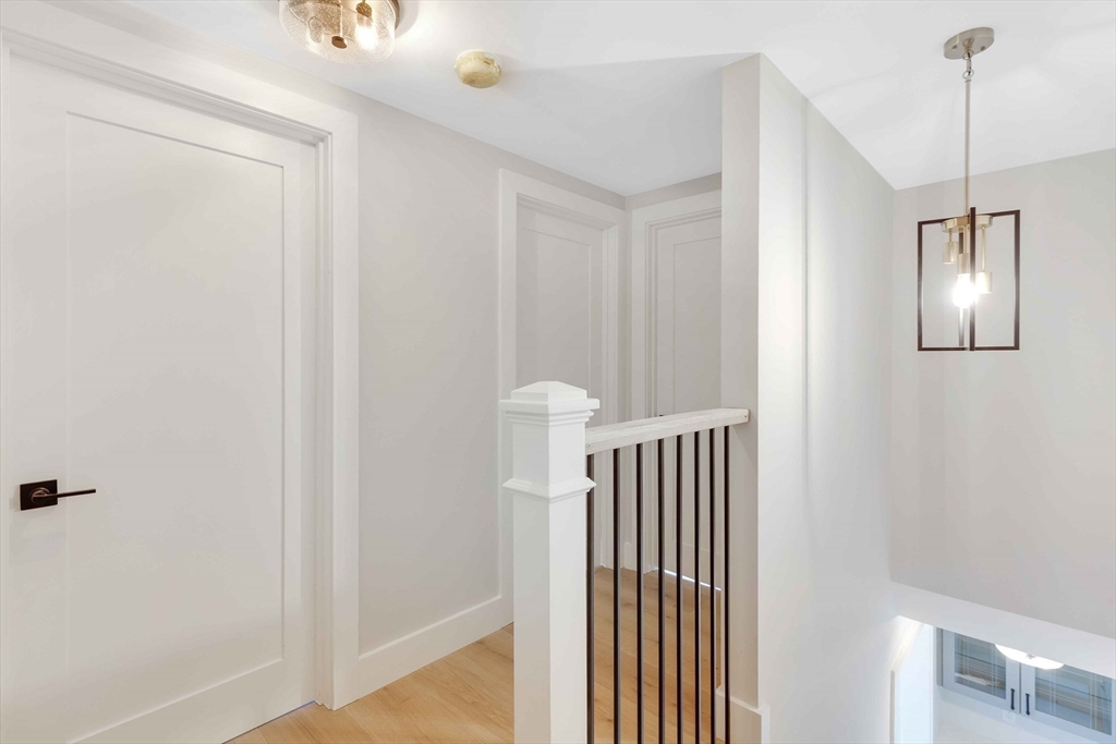 8 Crystal Street, Unit 3 Melrose, MA 02176 - Photo 19 of 24 a view of a hallway with entryway