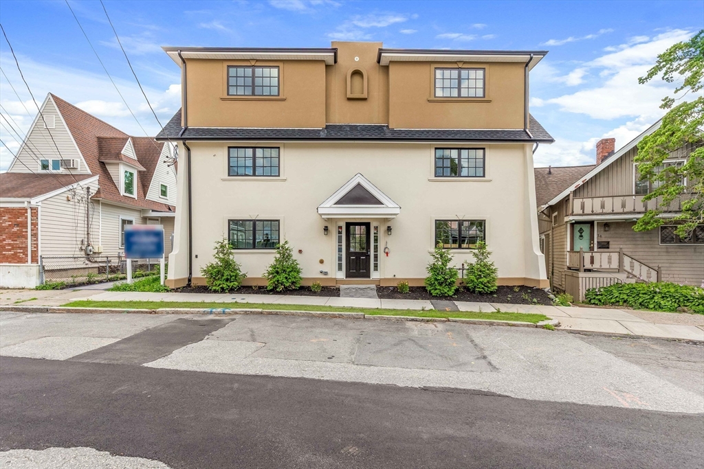 8 Crystal Street, Unit 3 Melrose, MA 02176 - Photo 2 of 24 front view of house with a yard