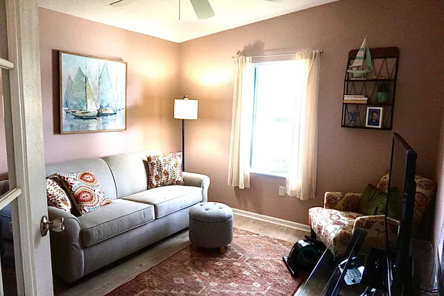 a living room with furniture and a window