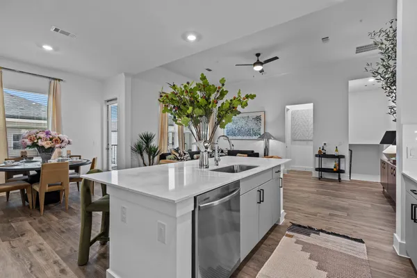 a kitchen with sink and cabinets