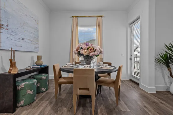 a view of a dining room with furniture and wooden floor