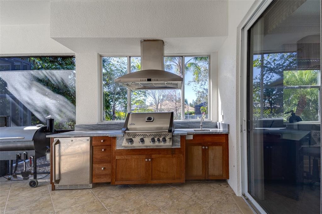 14721 Bowfin Terrace Lakewood Ranch, FL 34202 - Photo 12 of 50 a room with a stove and a table