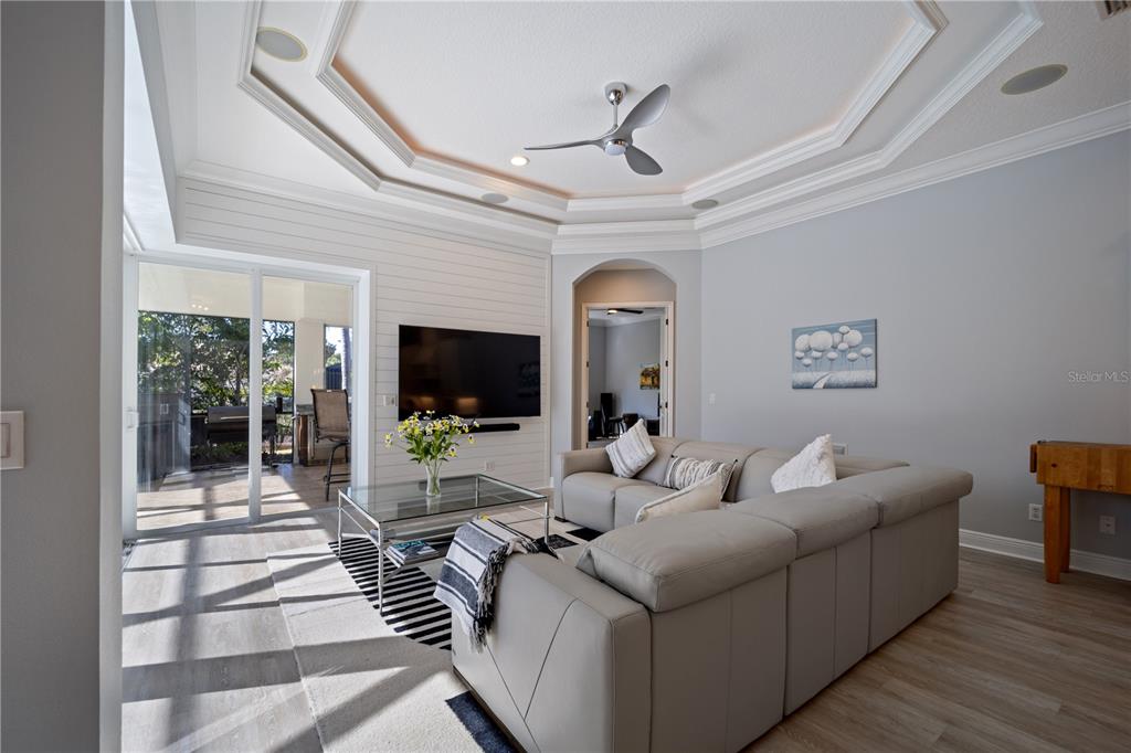 14721 Bowfin Terrace Lakewood Ranch, FL 34202 - Photo 13 of 50 a living room with furniture and a flat screen tv