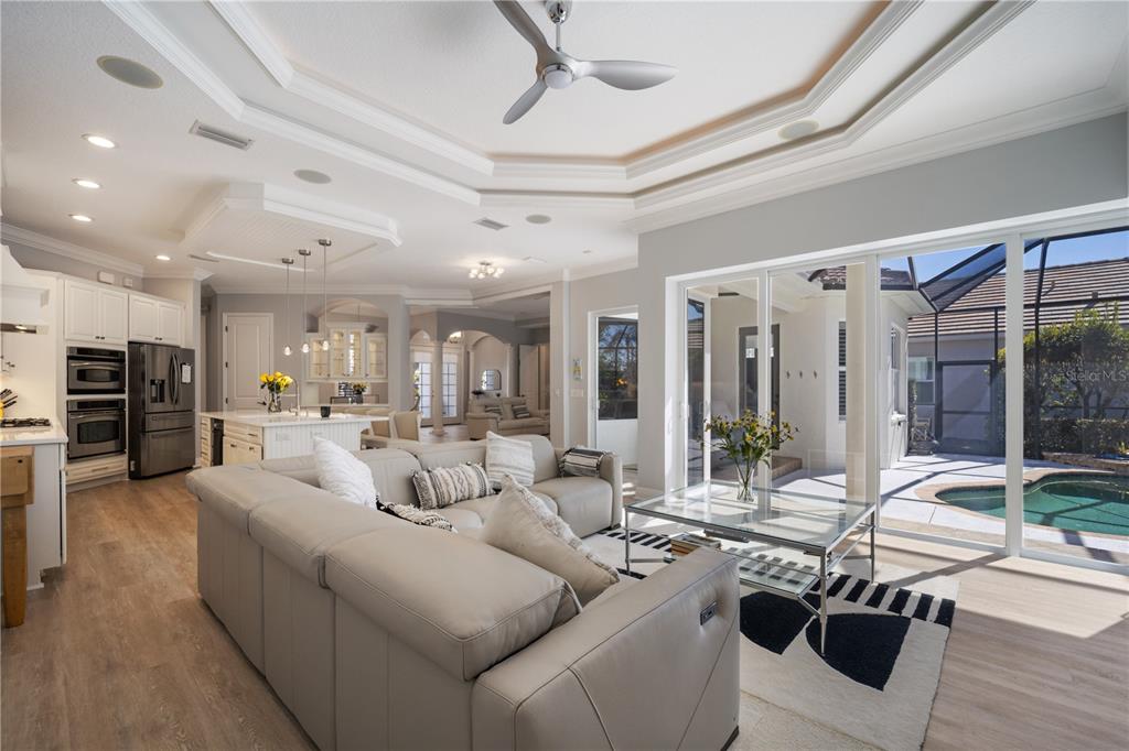 14721 Bowfin Terrace Lakewood Ranch, FL 34202 - Photo 14 of 50 a living room with furniture and a large window