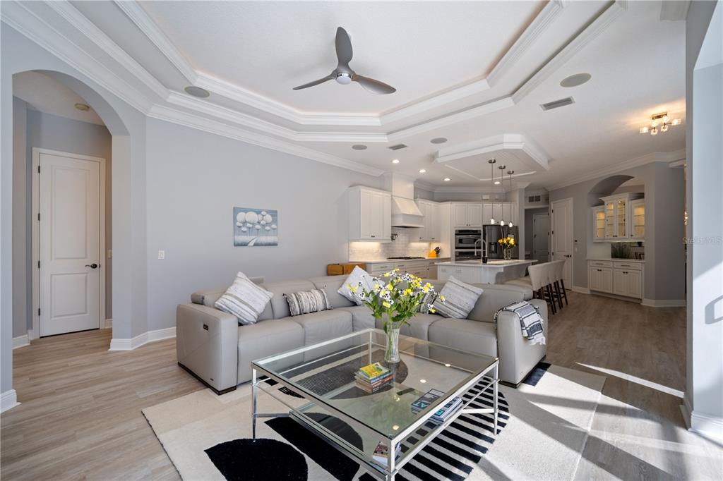 14721 Bowfin Terrace Lakewood Ranch, FL 34202 - Photo 15 of 50 a living room with furniture and a chandelier