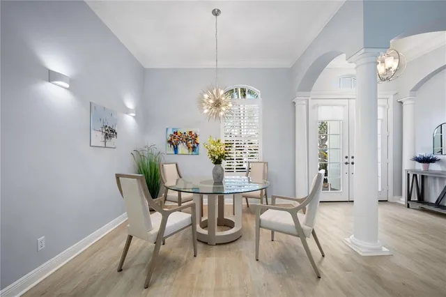 a view of a dining room with furniture window and wooden floor