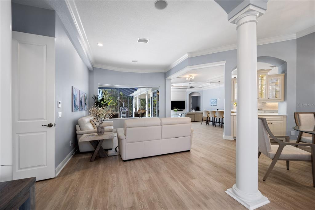 14721 Bowfin Terrace Lakewood Ranch, FL 34202 - Photo 18 of 50 a living room with furniture and a wooden floor