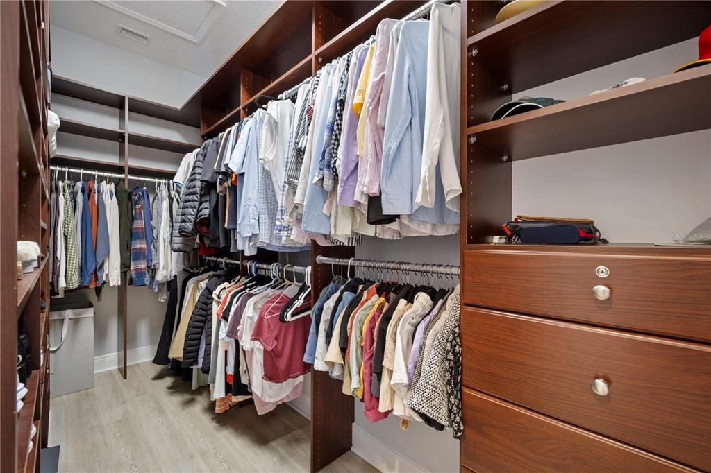 14721 Bowfin Terrace Lakewood Ranch, FL 34202 - Photo 25 of 50 a view of walk in closet with clothes and shoes