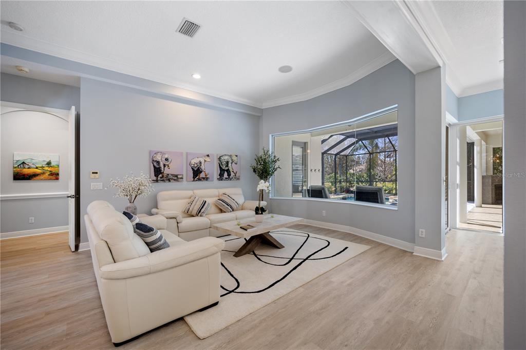 14721 Bowfin Terrace Lakewood Ranch, FL 34202 - Photo 26 of 50 a living room with furniture and a flat screen tv