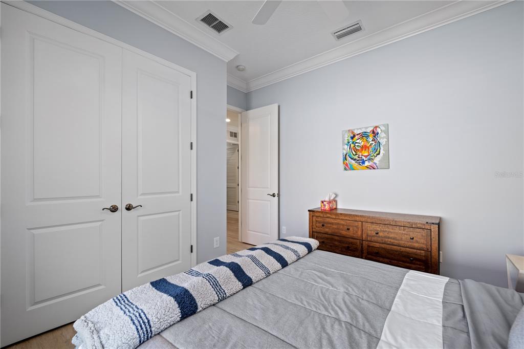 14721 Bowfin Terrace Lakewood Ranch, FL 34202 - Photo 30 of 50 a bedroom with a bed and furniture