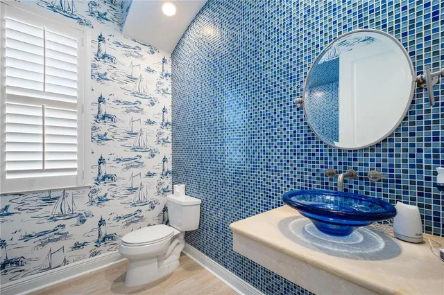 a bathroom with a toilet and a sink