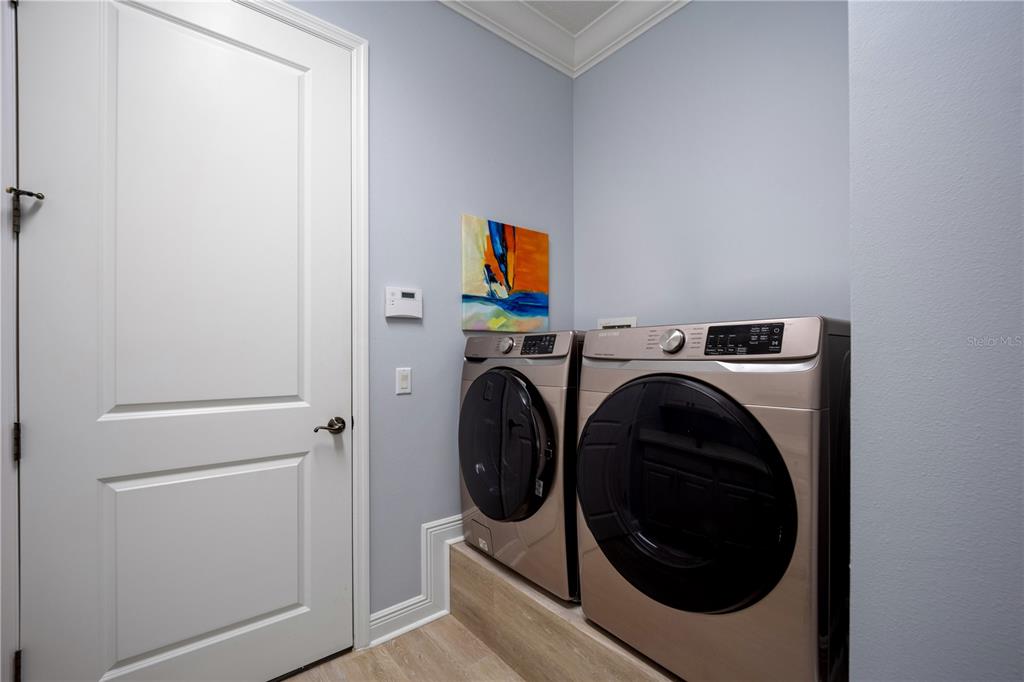 14721 Bowfin Terrace Lakewood Ranch, FL 34202 - Photo 43 of 50 a utility room with dryer and washer