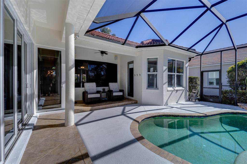 14721 Bowfin Terrace Lakewood Ranch, FL 34202 - Photo 10 of 50 a view of a house with sitting area and porch