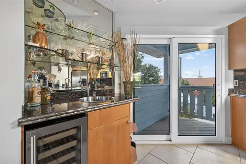 a kitchen with a sink and large window
