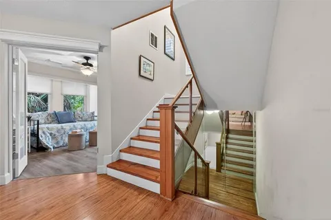 a view of entryway and hall with wooden floor