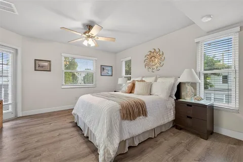 a spacious bedroom with a large bed and a window