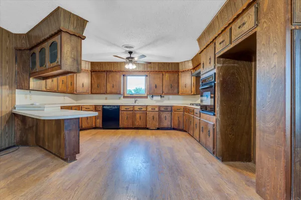 a kitchen with stainless steel appliances a sink and a refrigerator